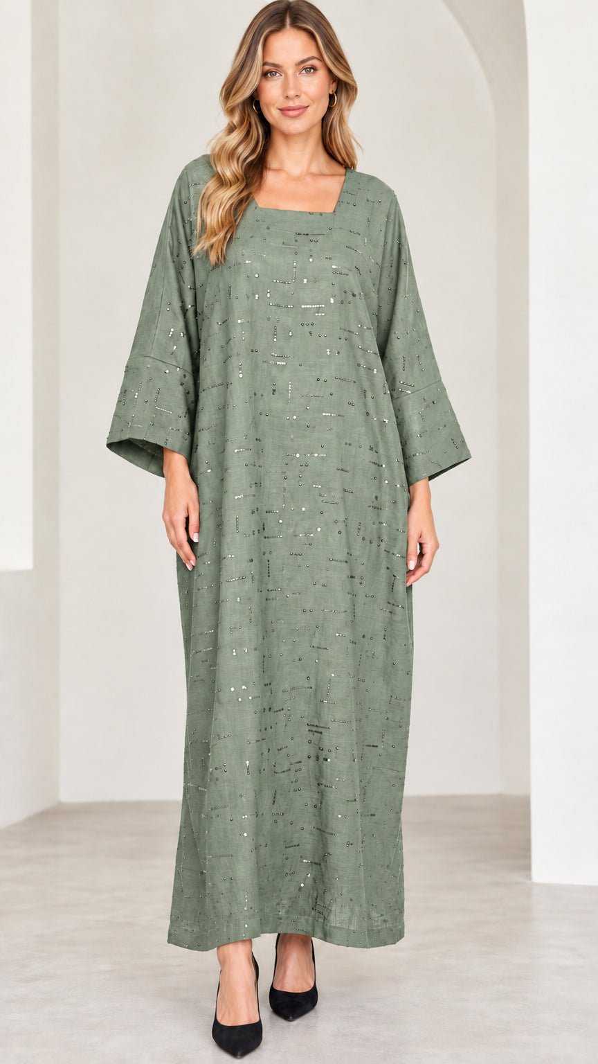 Model wearing sage green sequin loose fit kaftan dress