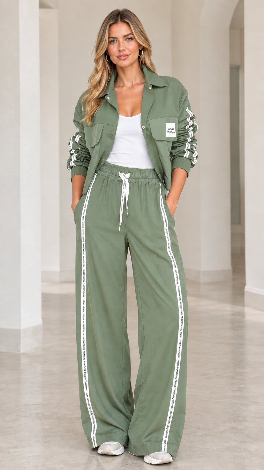 Model wearing Sage Green 2-piece cropped jacket and wide-leg track set