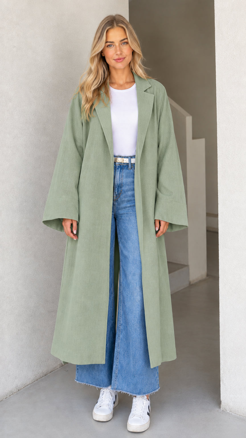 Model wearing Sage Green full-length duster coat with notched lapel