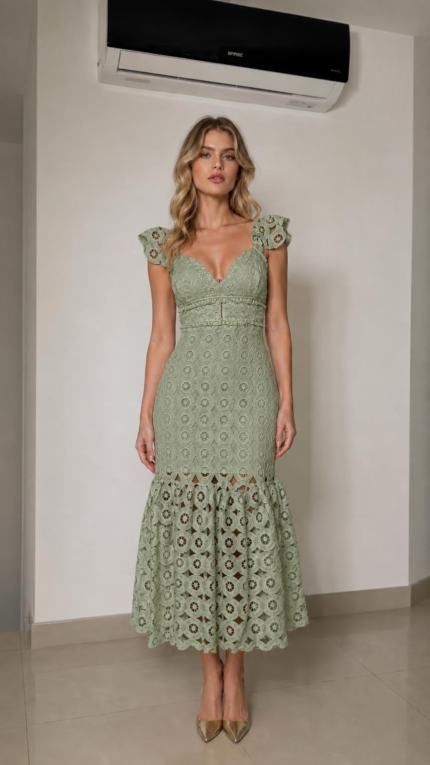 Front view of woman wearing sage green lace mermaid midi dress