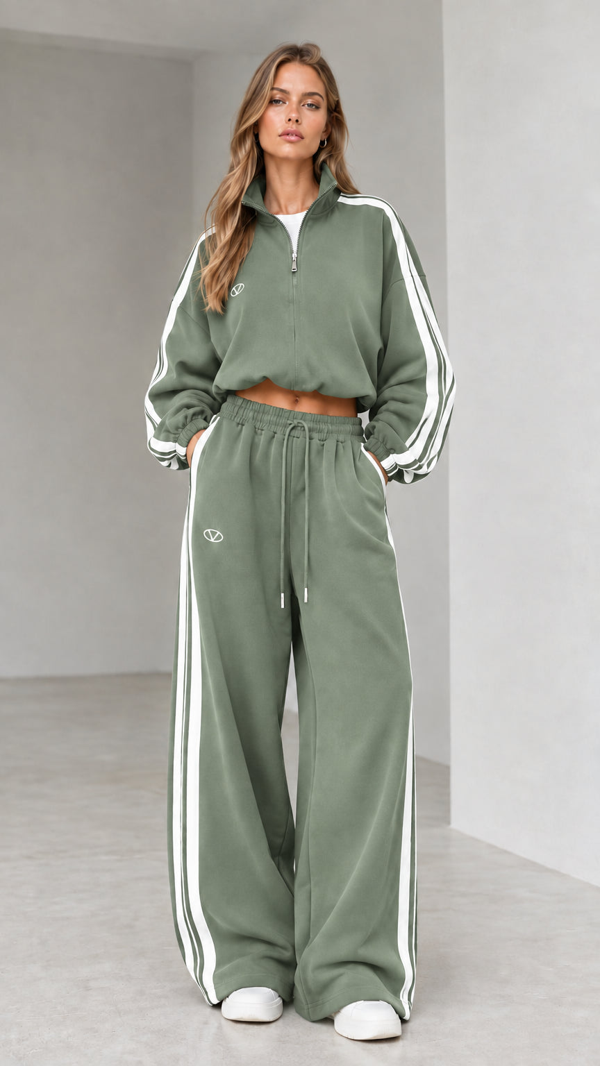 Front view of woman wearing sage green cropped quarter-zip tracksuit set