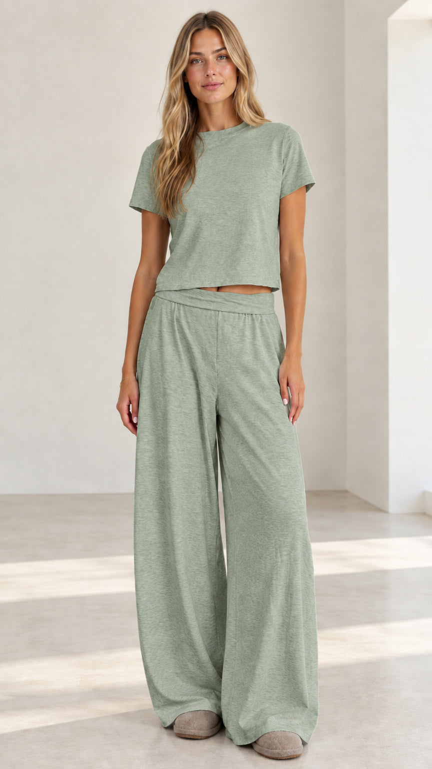 Model wearing sage green matching crop tee and wide leg palazzo lounge pants set