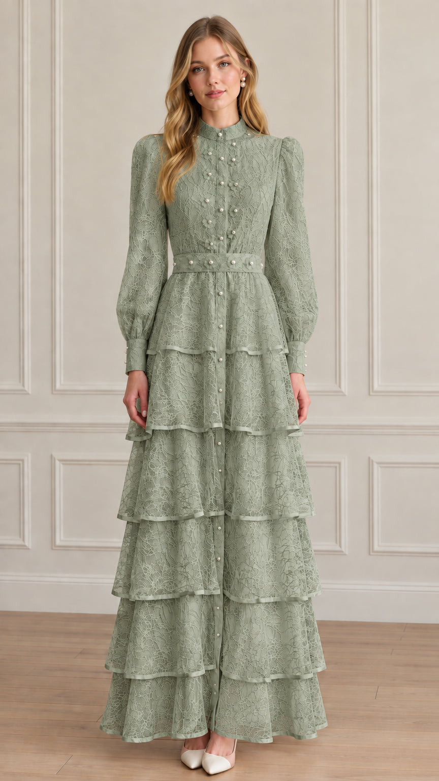 Model wearing sage green tiered lace maxi dress with high neck and pearl details