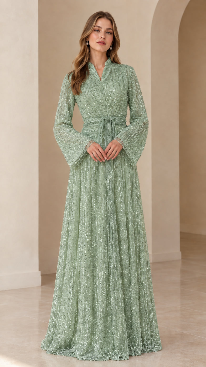 Front view of model wearing sage green sequined long sleeve evening gown
