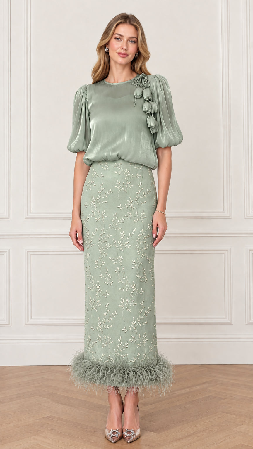 Model wearing Sage Green puff sleeve blouse and matching feather trim column skirt