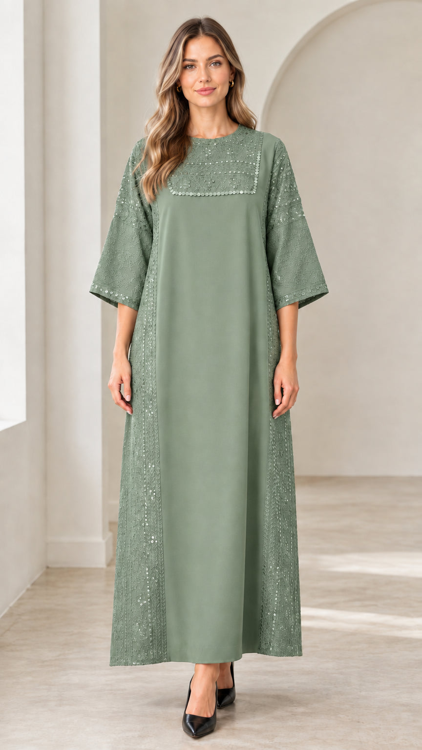 Front view of woman wearing sage green sequin embellished maxi dress