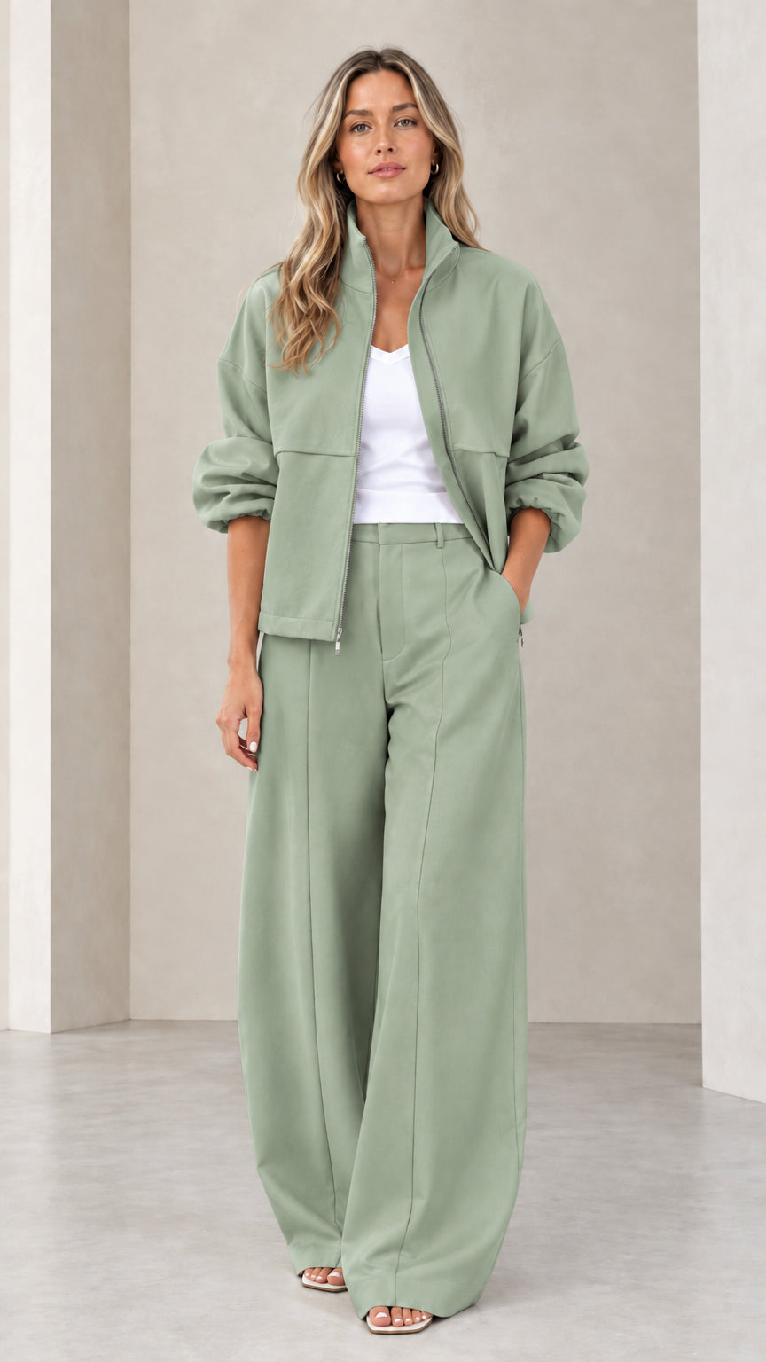 Full front view of women's sage green zip-up jacket and wide-leg pants two-piece set