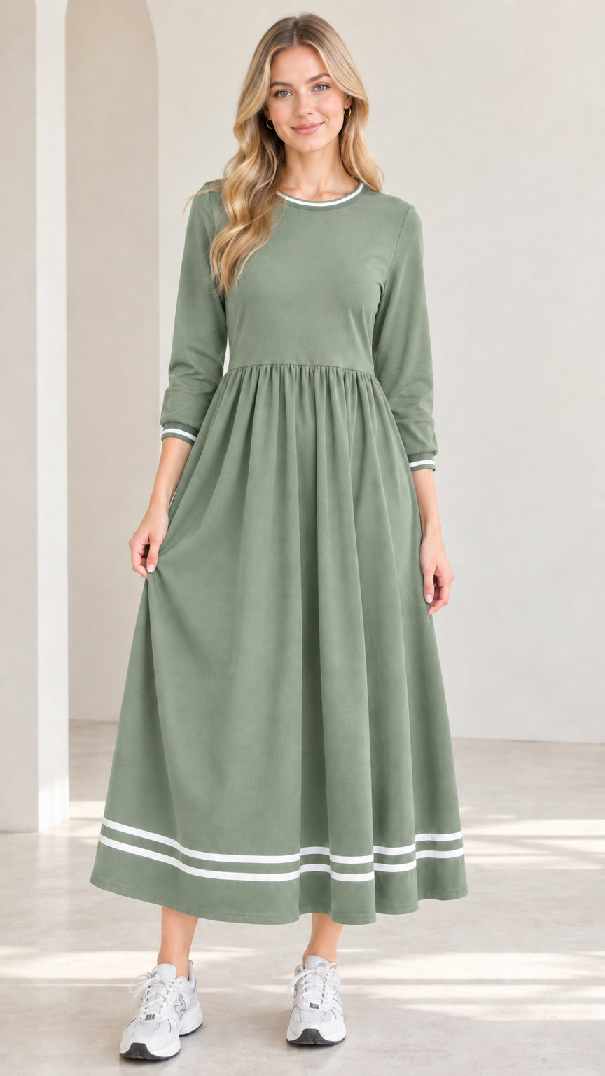 Front view of model wearing sage green 3/4 sleeve maxi dress with white striped trim