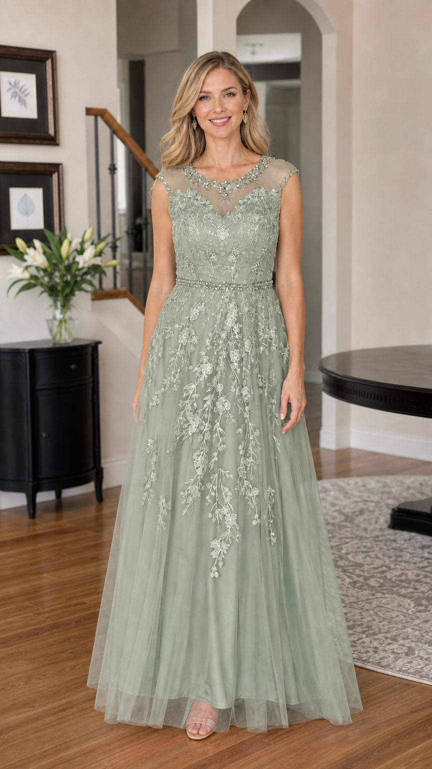 Woman wearing sage green embroidered tulle evening gown