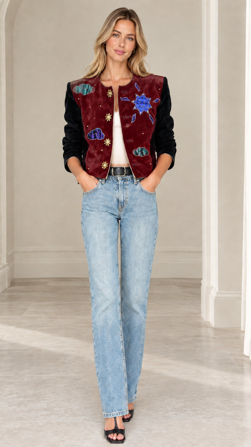 Model wearing burgundy celestial applique cropped jacket with black velvet sleeves