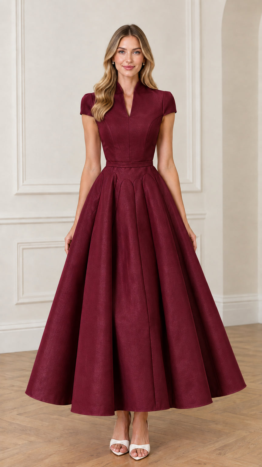 Front view of woman wearing Burgundy red split collar pleated maxi gown