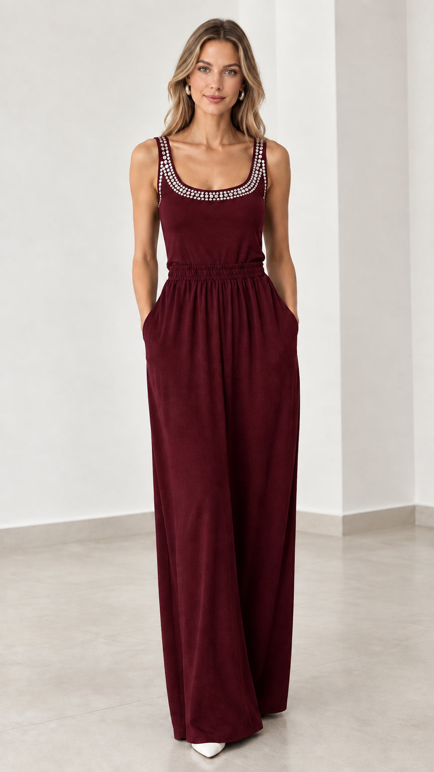 Front view of model wearing burgundy wine red rhinestone wide leg jumpsuit