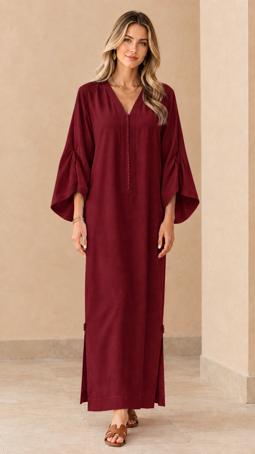 Front view of woman wearing burgundy wine red long kaftan dress