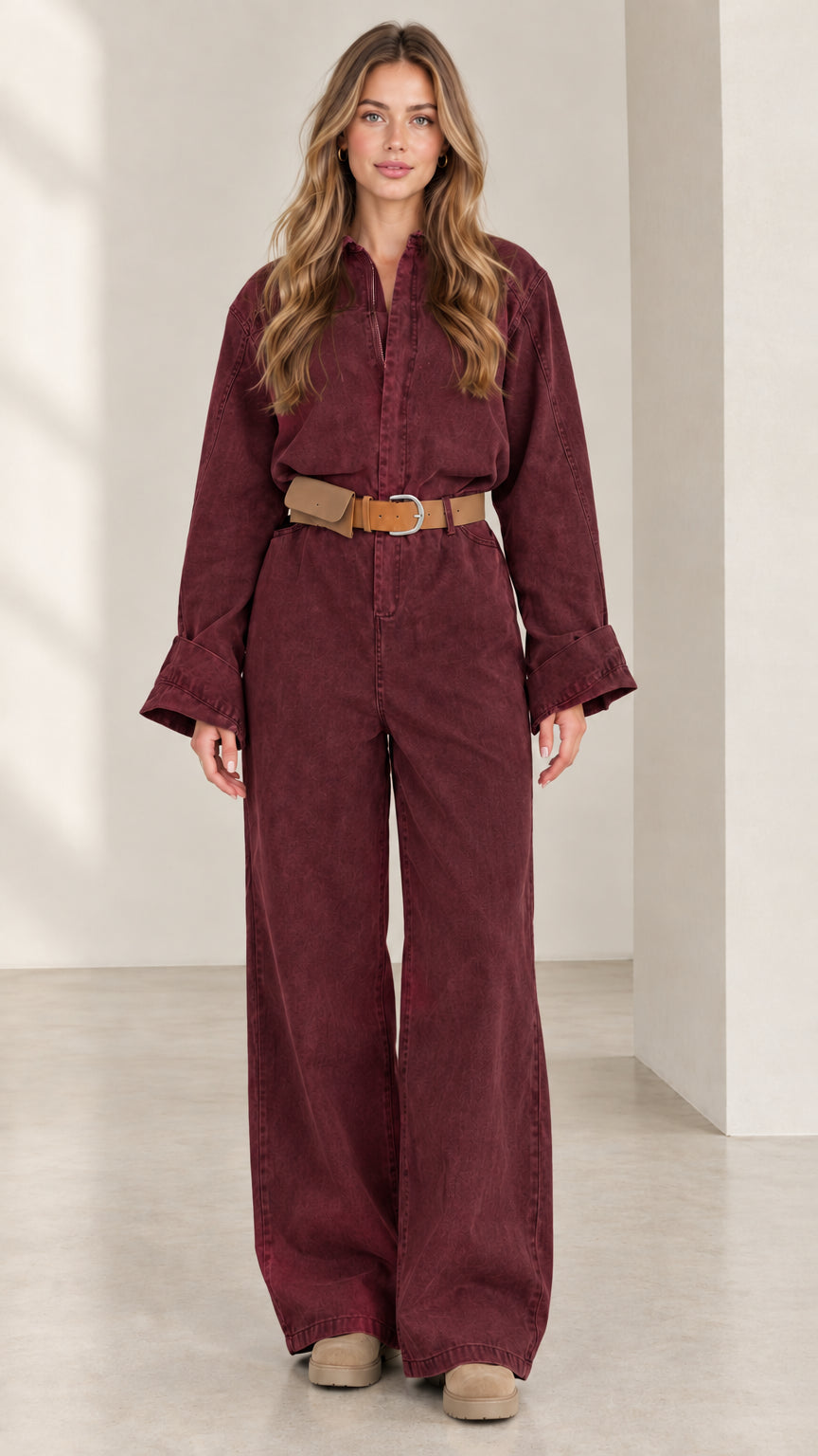 Front view of women's burgundy wine long sleeve wide leg utility jumpsuit
