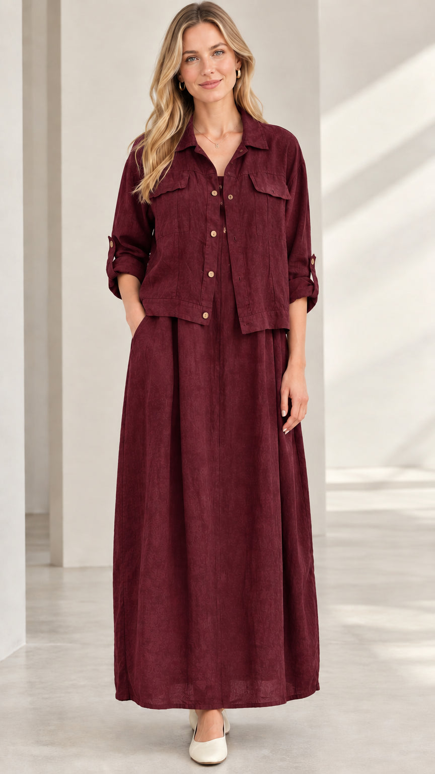 Model wearing burgundy wine red long sleeve shirt jacket and maxi skirt set