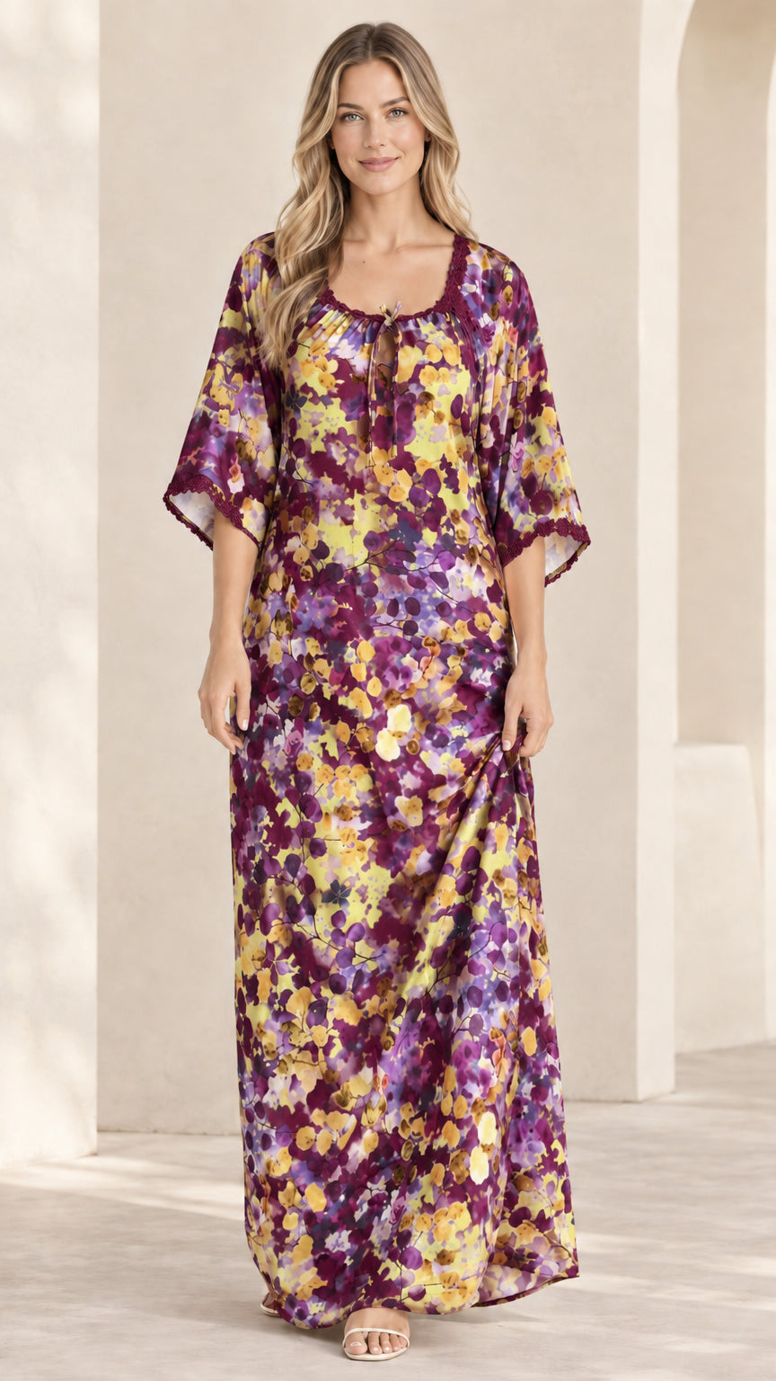 Front view of plum burgundy floral kaftan maxi dress with lace trim