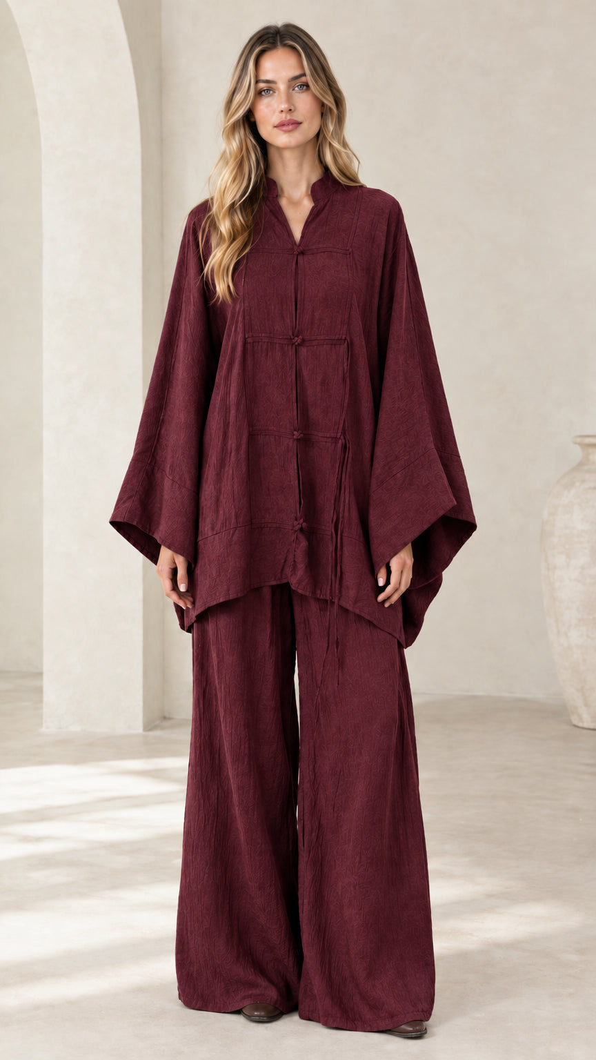 Front view of women's burgundy red frog button tunic and wide leg pant set