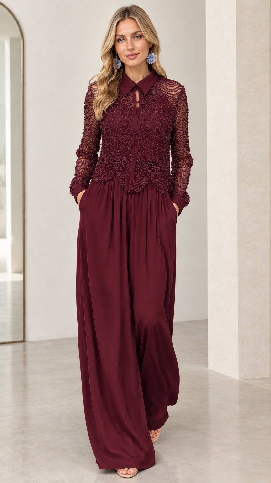Front view of model wearing burgundy wine collared lace long sleeve wide leg jumpsuit