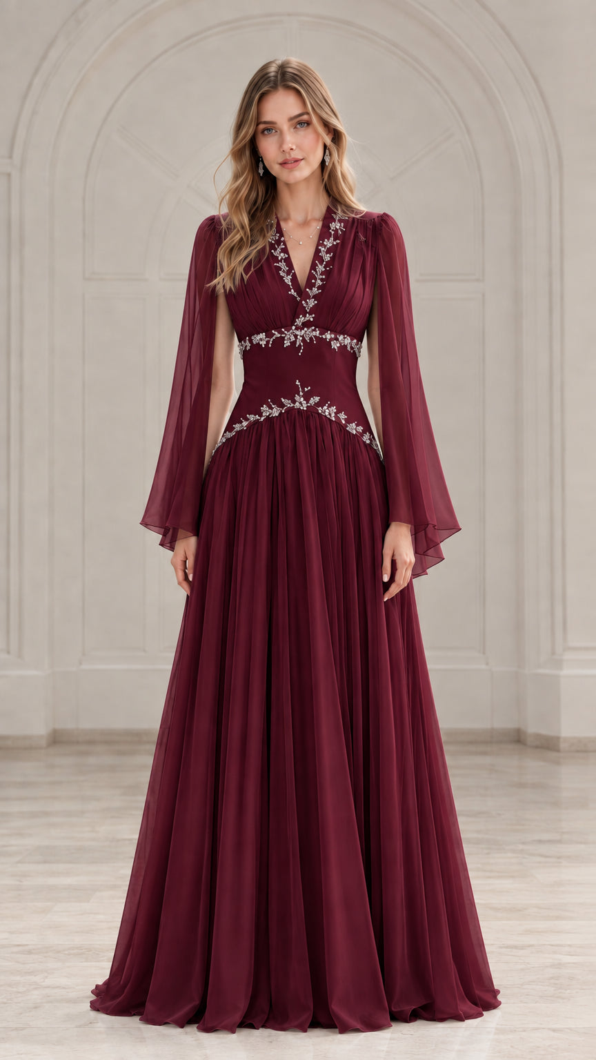 Front view of model wearing a rich burgundy wine chiffon formal gown with cape sleeves