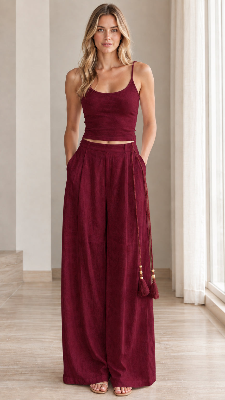 Front view of model wearing burgundy red crop top and wide leg pants set