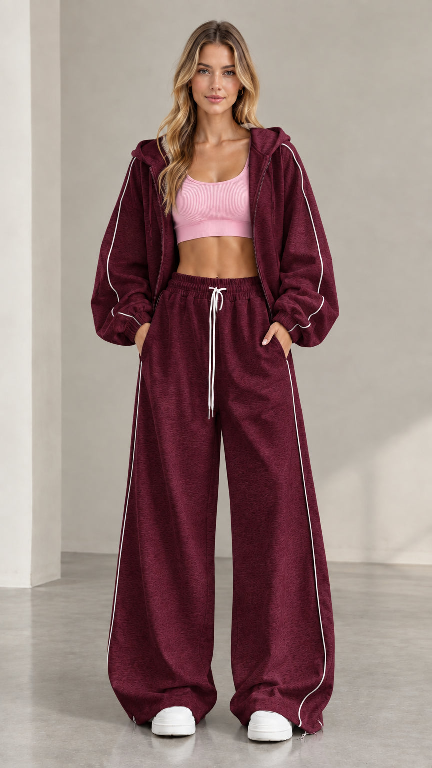 Model wearing Burgundy two-piece zip-up hoodie and sweatpants set