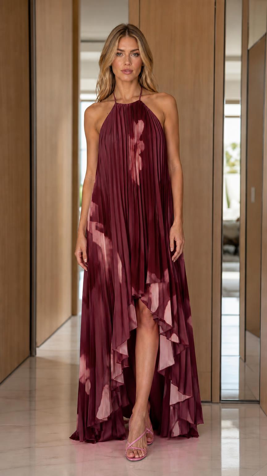 Front view of woman wearing burgundy pleated halter maxi dress
