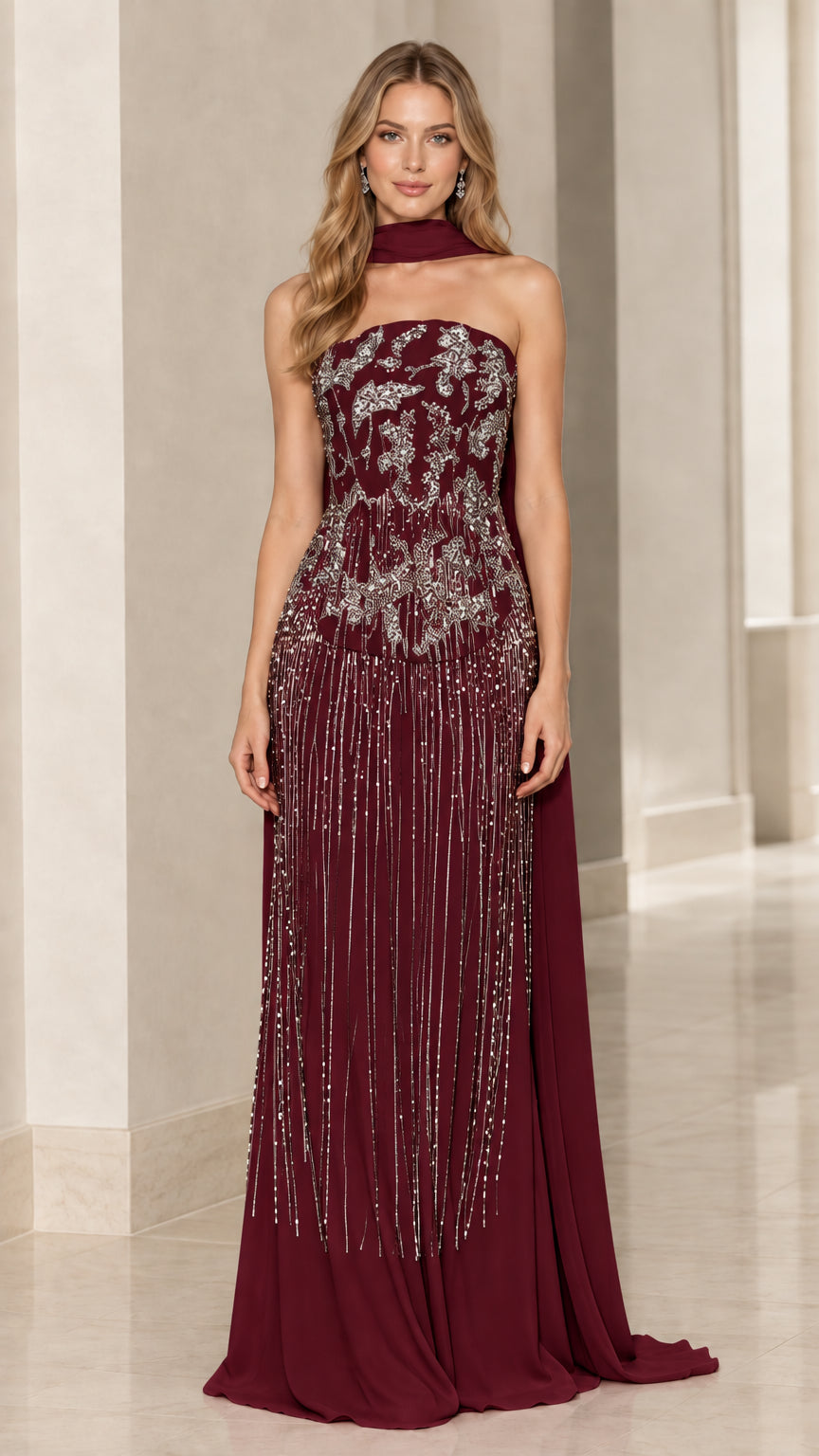 Model wearing burgundy wine strapless beaded evening gown with matching scarf