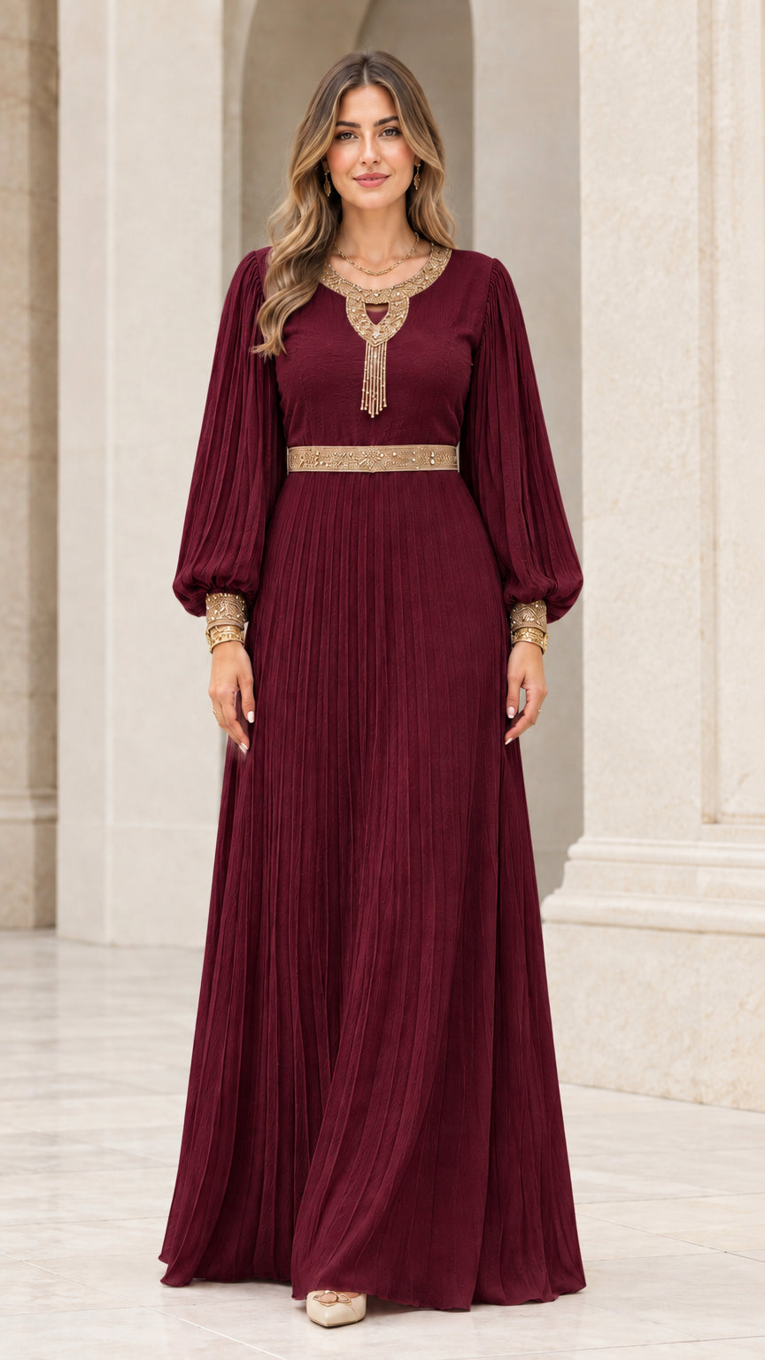 Front view of rich burgundy wine pleated maxi dress with gold embroidery
