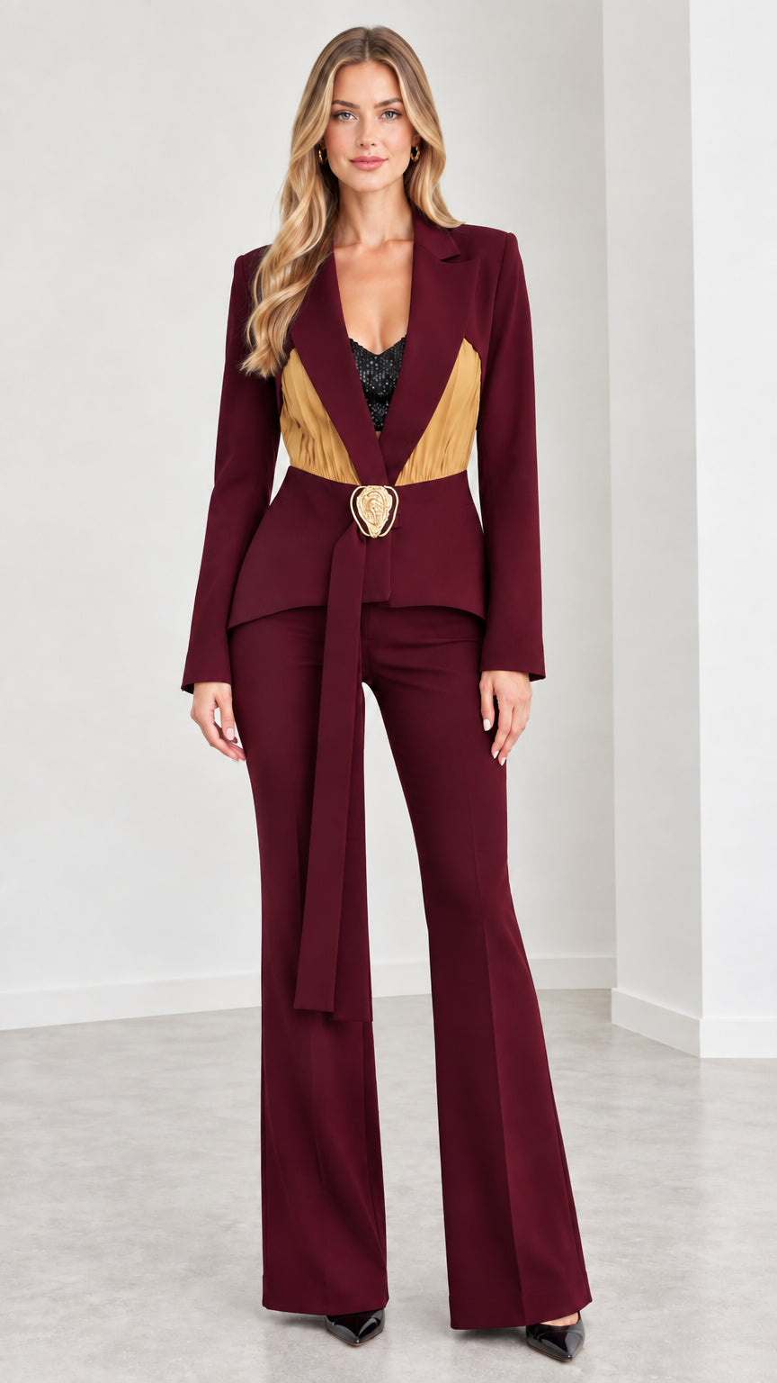 Model wearing rich burgundy formal belted blazer and pant set