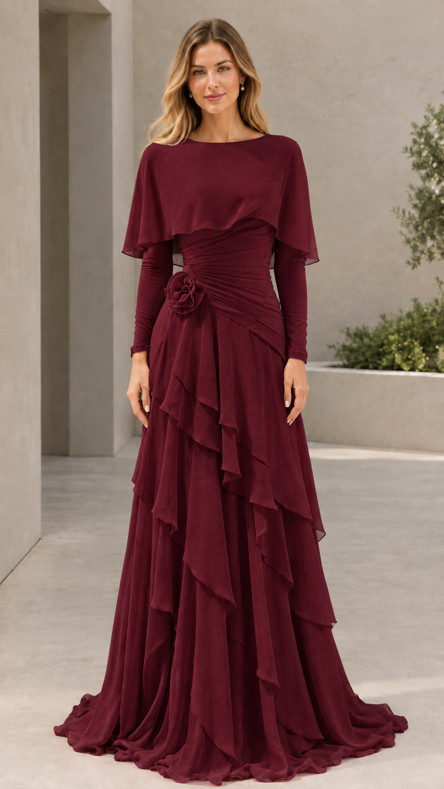 Woman wearing Burgundy long sleeve capelet tiered evening maxi gown