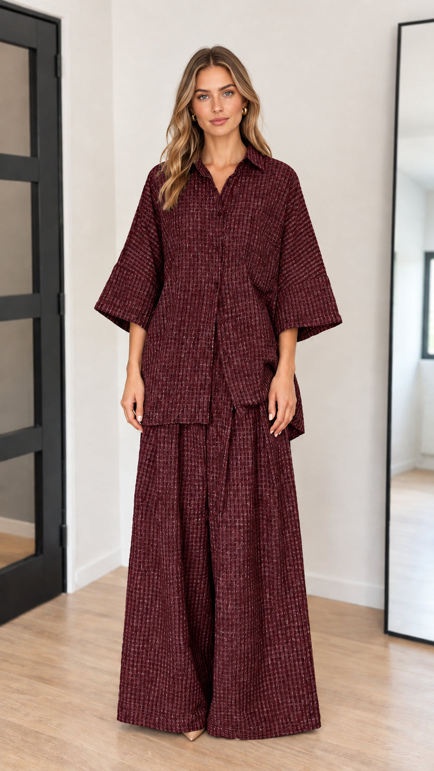 Front view of model wearing burgundy wine red textured two-piece set