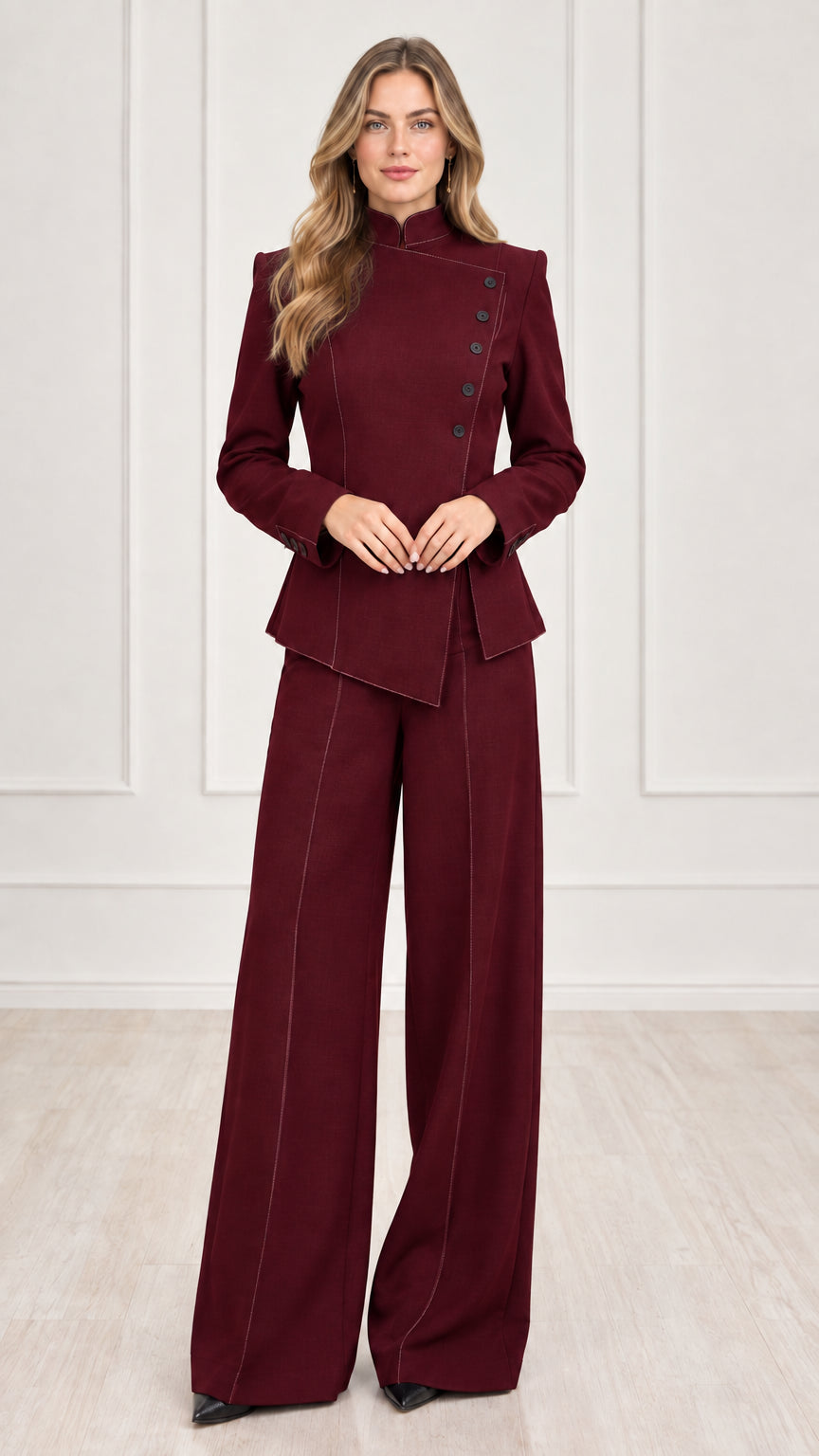 Full length view of women's burgundy wine red asymmetric blazer and wide-leg suit set
