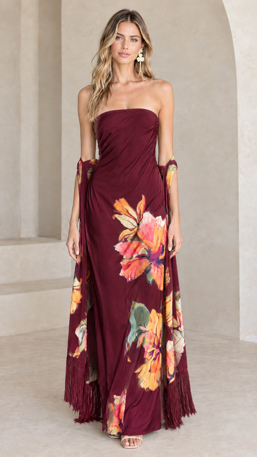 Burgundy strapless maxi evening dress with colorful floral print and fringe shawl