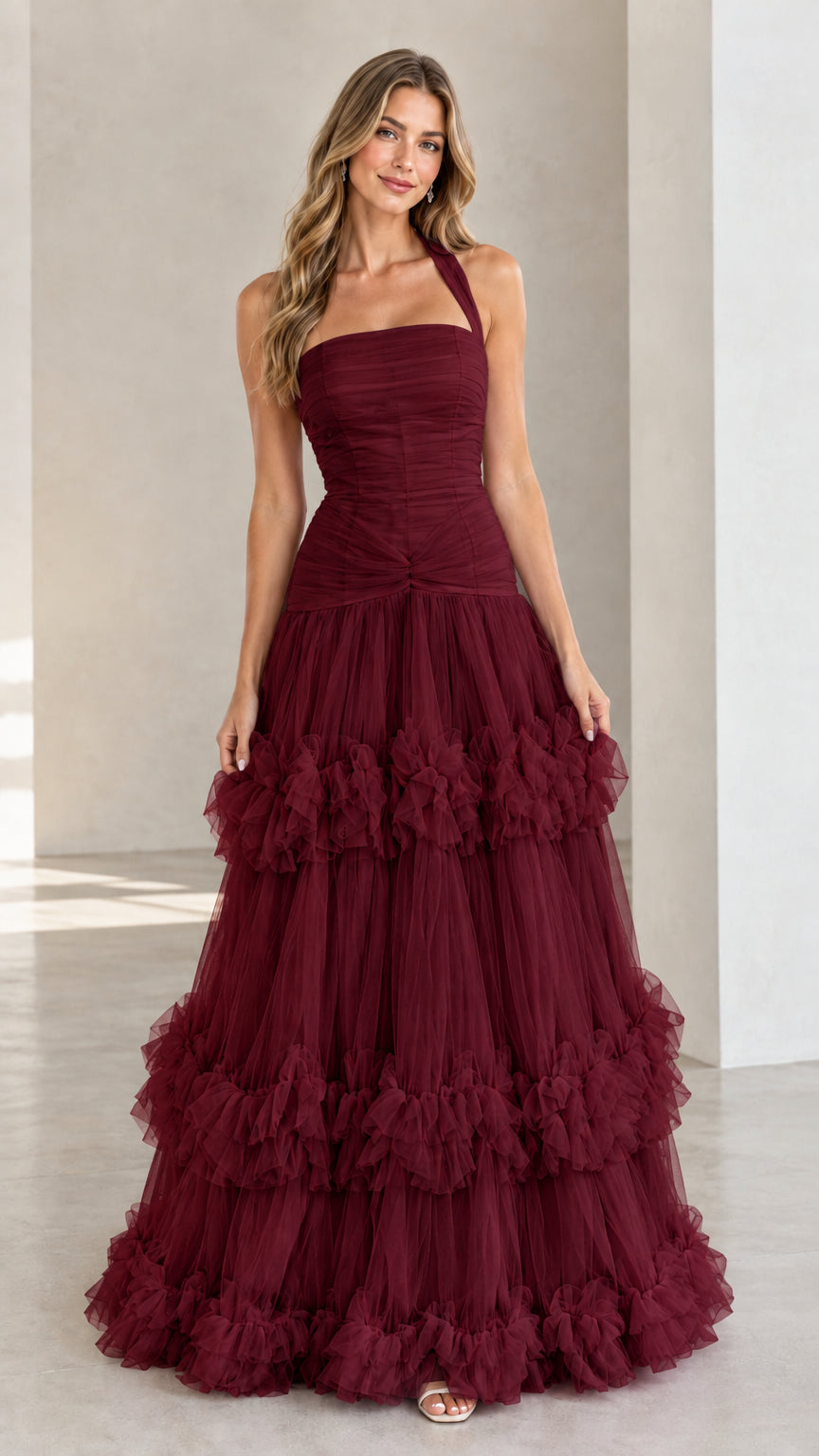 Front view of woman wearing Burgundy wine red halter neck tiered tulle evening dress