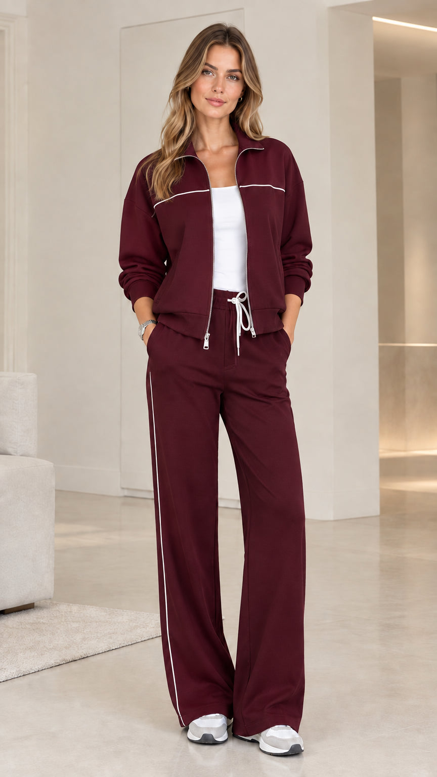 Model wearing rich burgundy wine red zip-front tracksuit set