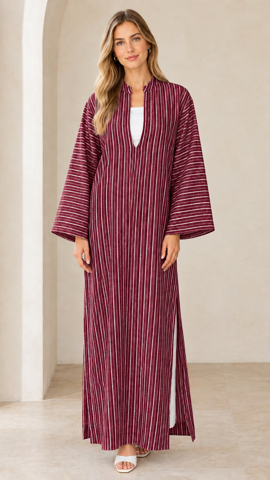 Woman wearing burgundy vertical striped maxi kaftan dress