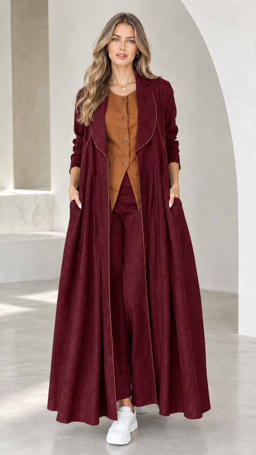 Front view of model wearing Burgundy pleated maxi duster coat