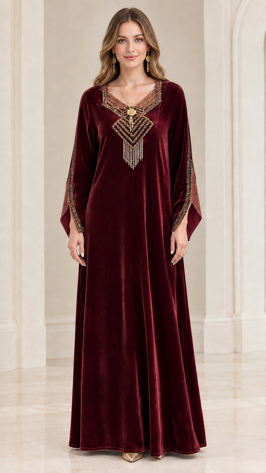 Front view of burgundy wine red velvet kaftan maxi gown with tassel detail