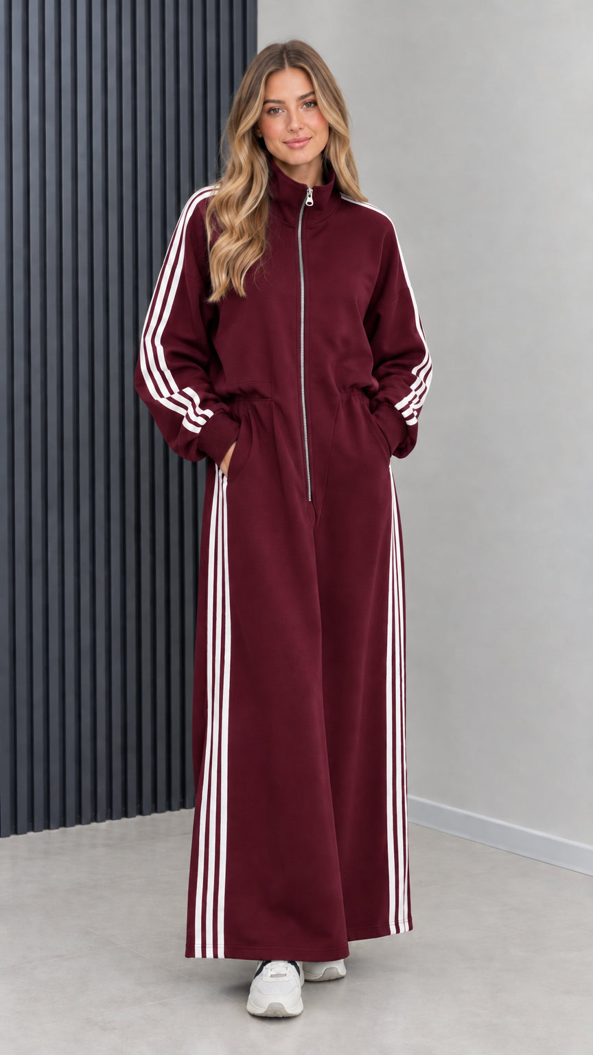 Front view of model wearing burgundy wine red full-zip athletic maxi dress
