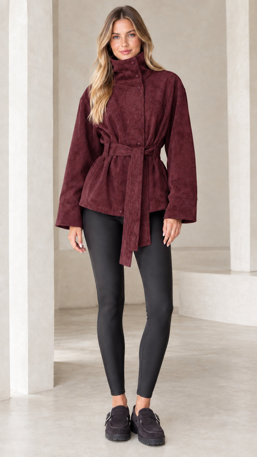 Model wearing burgundy high-neck belted faux suede jacket