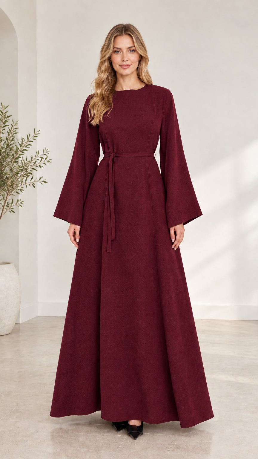 Full-length front view of woman wearing burgundy wine red long bell sleeve maxi dress