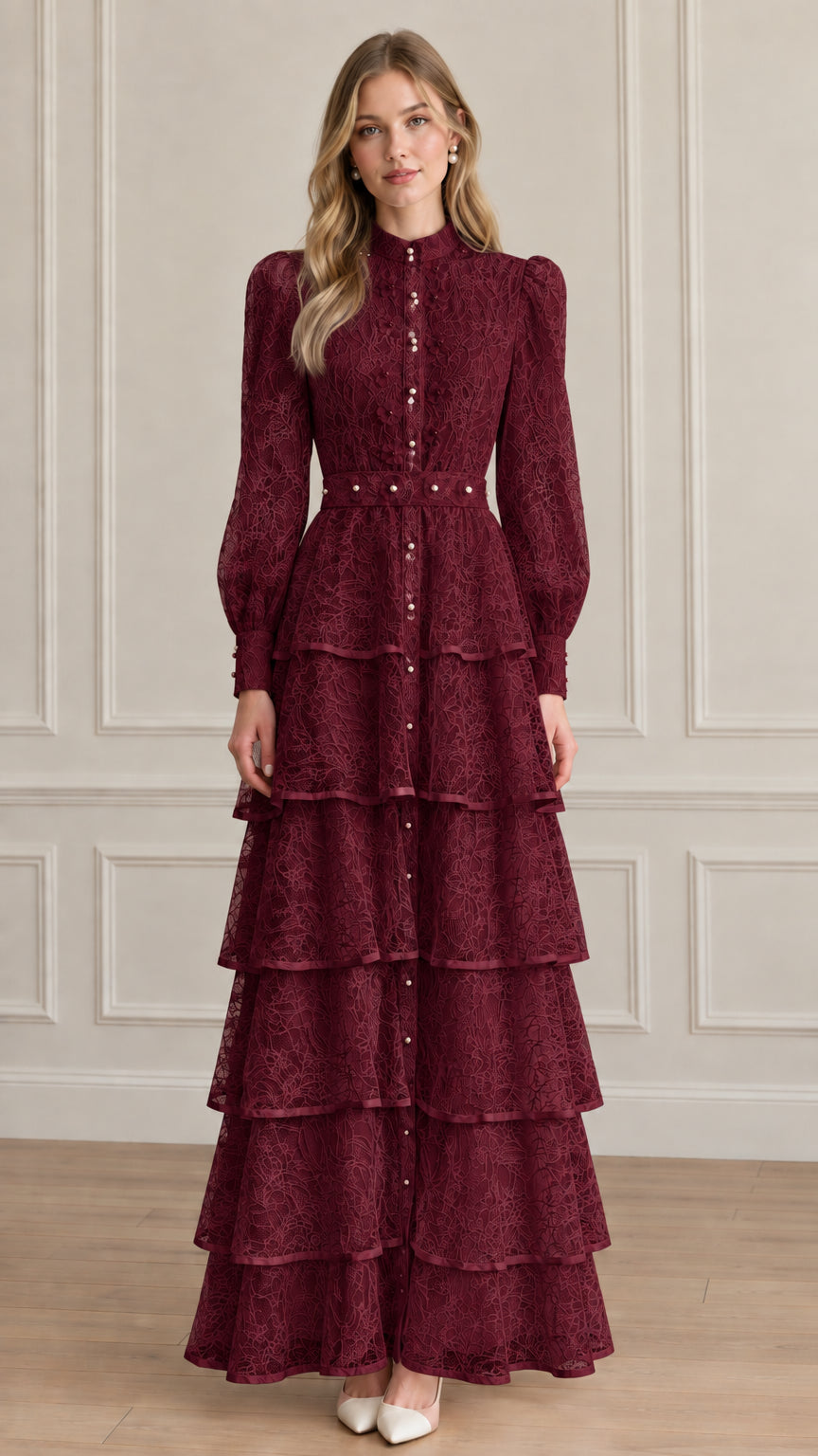 Model wearing deep burgundy red tiered lace maxi gown with long sleeves