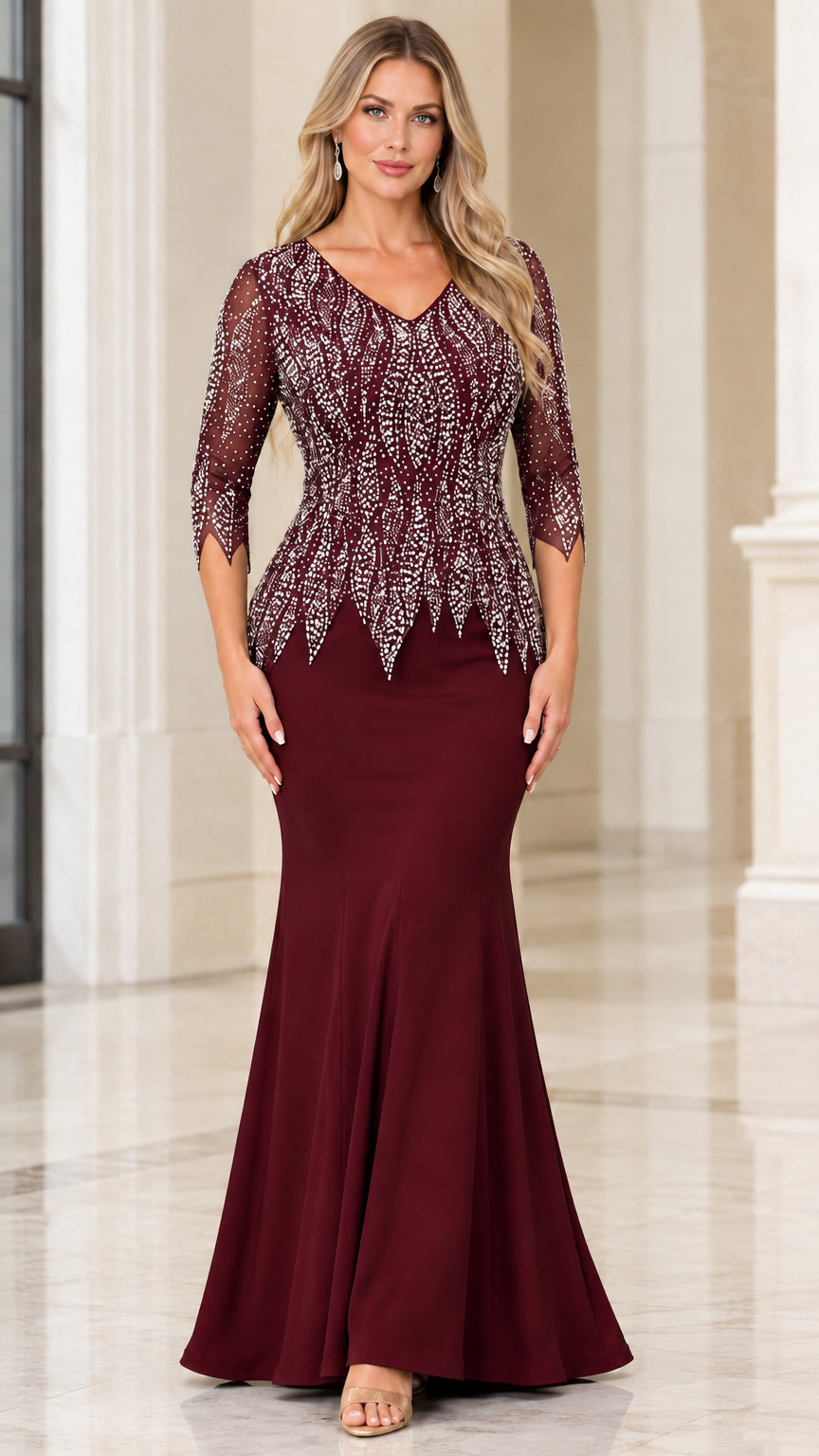 Woman wearing burgundy wine red rhinestone formal gown with mermaid skirt