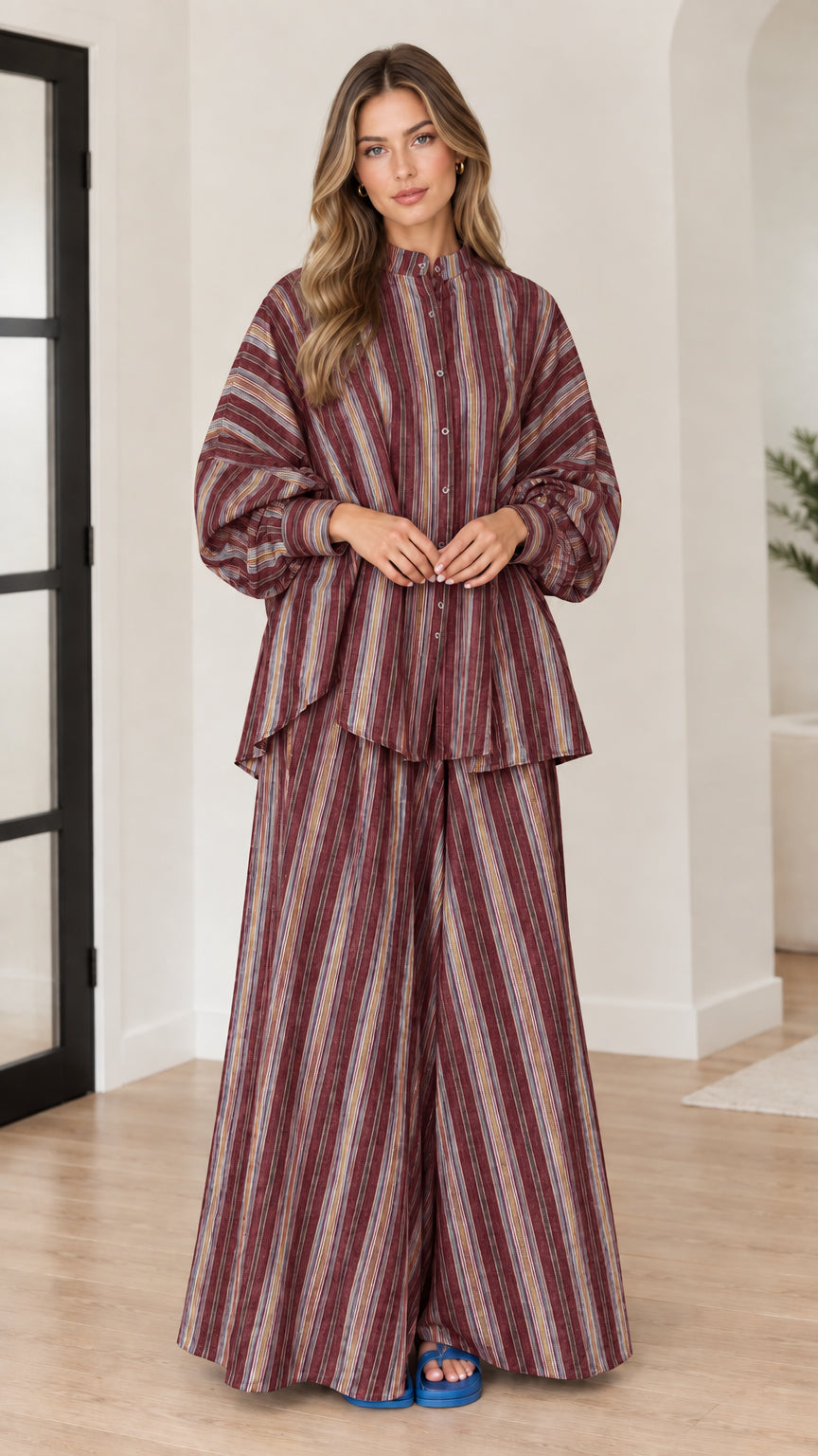 Woman wearing burgundy wine vertical striped matching two-piece set