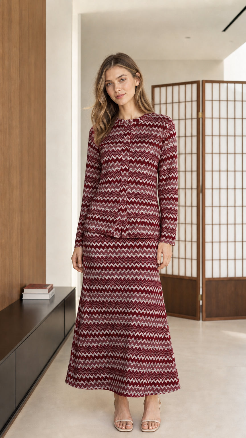 Front view of model wearing burgundy red chevron knit matching top and skirt set