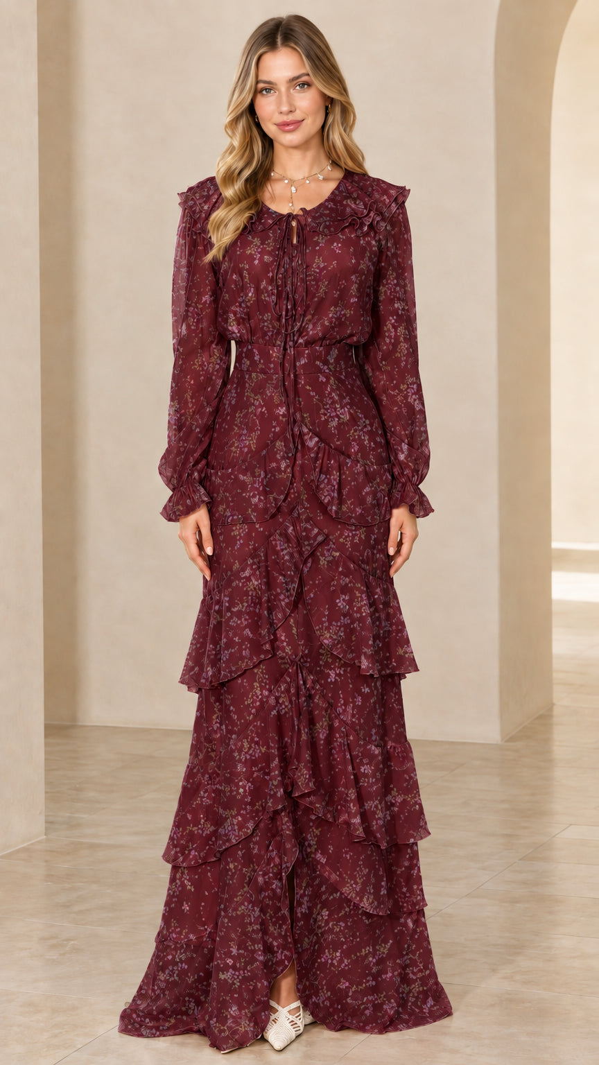 Front view of long sleeve tiered floral maxi dress in burgundy