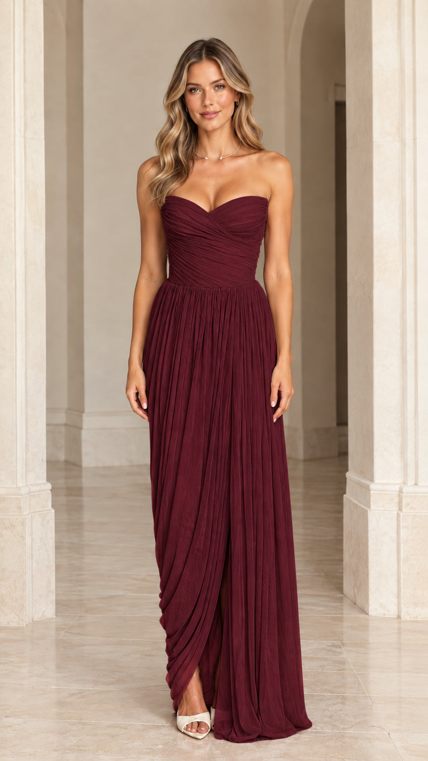 Burgundy strapless pleated sweetheart corset gown with front slit
