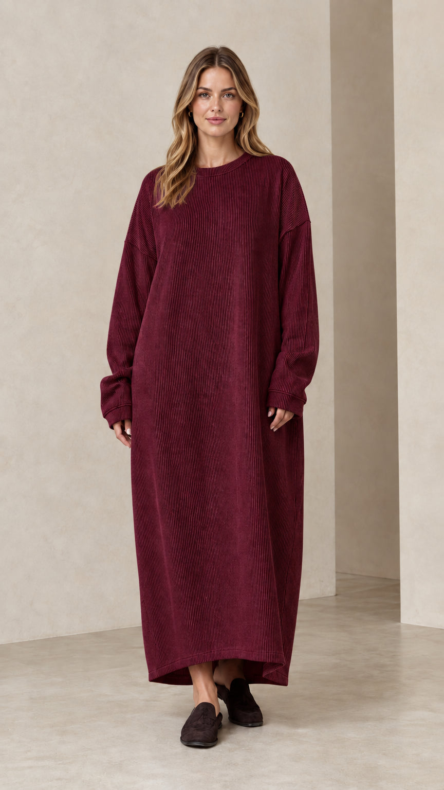 Woman wearing burgundy wine red ribbed knit oversized maxi dress