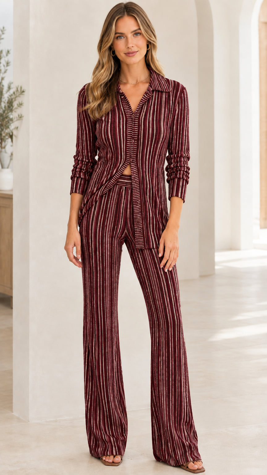 Front view of woman wearing Burgundy striped ribbed knit shirt and flare pants set