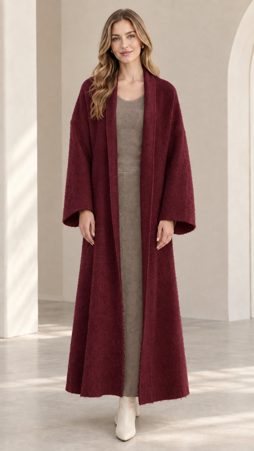 Front view of model wearing burgundy wine-red textured maxi duster coat